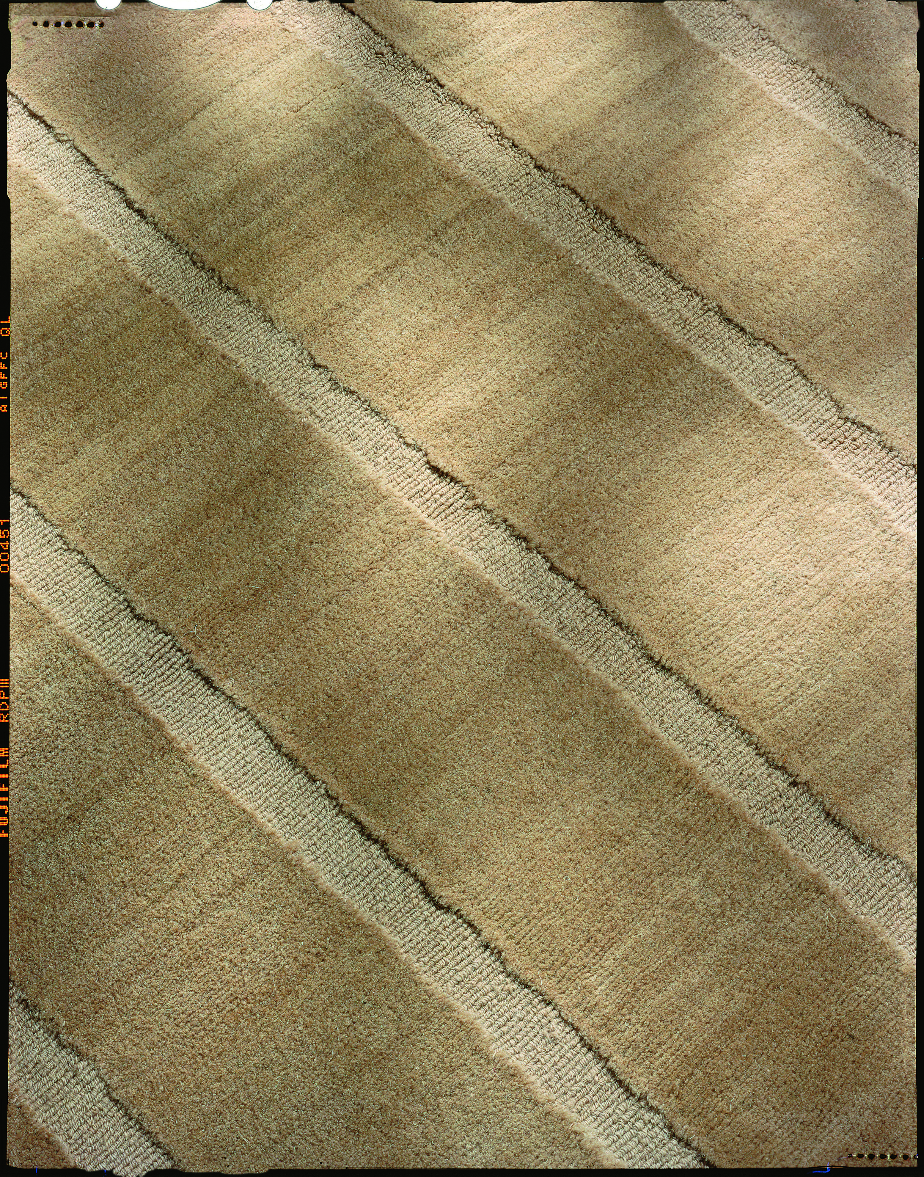 BADOURA 
Pared down and minimalist David Shaw Nicholls Carpet design in reverse pile as shown, coloured in Honey _ Wheat,
No machines involved, all finished by hand scissor clipping.